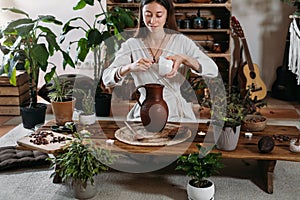 Pouring water into jug with cacao. Ceremonial cocoa ritual