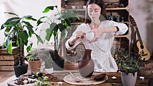 Pouring water into jug with cacao. Ceremonial cocoa ritual