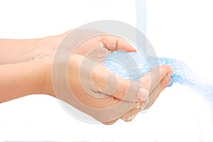 Pouring water splashing on hand