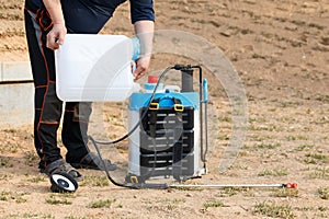 pouring weed killer on crop duster