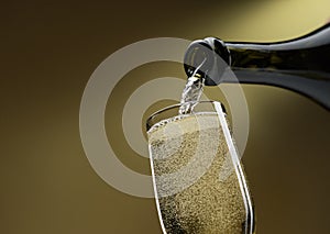 Pouring white wine into a wineglass