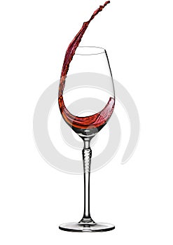 Pouring wine to elegant wineglass with splash