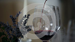 pouring wine in to special glass