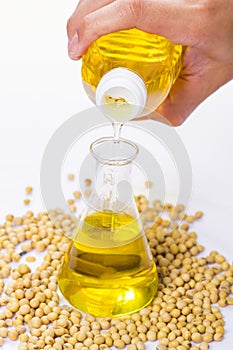 Pouring yellow soya bean oil