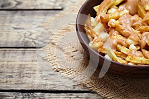 Poutine Canadian homemade traditional fast food meal with fries