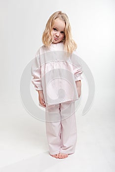 Pouting blonde kid in her pajamas