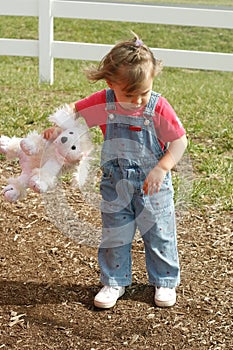 Pouting Child with Stuffed Animal in Hand