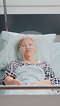 POV of aged woman with sickness talking on video call
