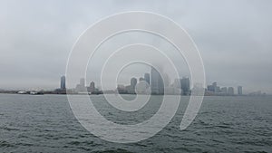 POV from Ferry on the Battery Park City, NYC in Manhattan, USA starting the winter in Hudson River