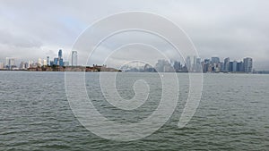 POV from Ferry on the Battery Park City, NYC in Manhattan, USA starting the winter in Hudson River