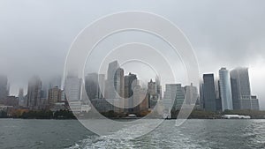 POV from Ferry on the Battery Park City, NYC in Manhattan, USA starting the winter in Hudson River