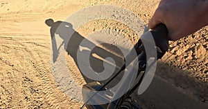 POV, hands and off road motorbike with person on dirt track for adrenaline, adventure or speed closeup. Bike, sports and
