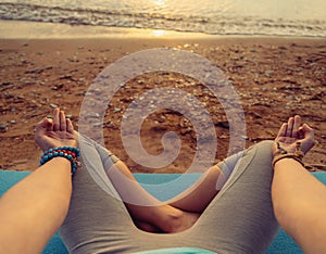 POV image of woman meditating in pose of lotus