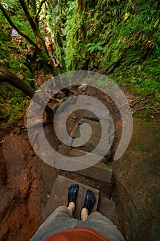 POV looking downhill on a steep stairway to Devilâ€™s Pulpit gorge