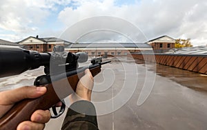 POV of male hands shooting with air rifle