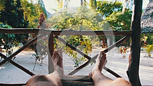 POV of Man Legs on the Tropical Hotel Veranda, Summer Vacation, Zanzibar, Africa