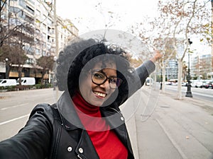 POV of a middle aged African American woman influencer making a video in a city