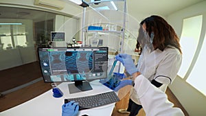 POV of researcher doctor writing medical reports at computer