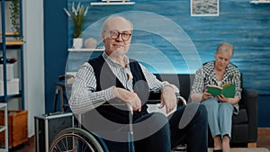 POV of retired man with disability talking on video call to family