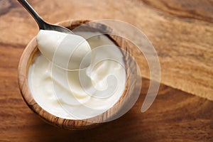 Pov shot of full spoon of yogurt