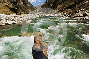 POV shot of a traveller on the bridge of a river