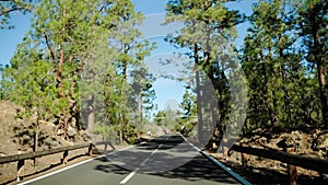 POV view from the car on the asphalt mountain road on a warm summer day