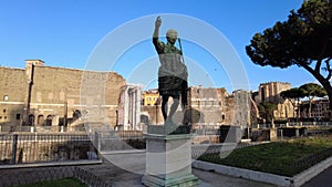 Pov view of Trajan imperator statue located Fori Imperiali street in Rome,Italy