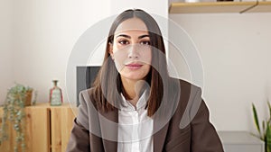 POV young businesswoman listening colleague on laptop video call in the office