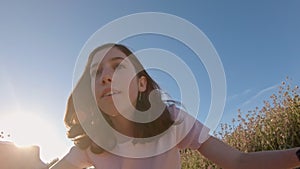 POV of a young girl enjoying a bicycle ride on the rural countryside