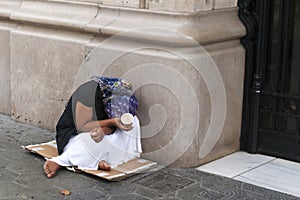Poverty-stricken female beggar