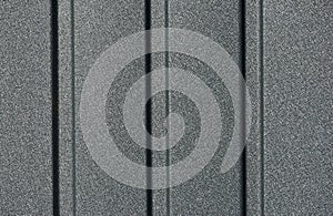 powder coated textured gray metal siding macro detail vertical flutes