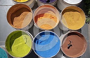 Powder coating cans. Various colors. Photographed on a sold out counter photo