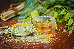 Powder of Indian iliac or neem with raw turmeric and honey used in many old and modern teeth treatments.