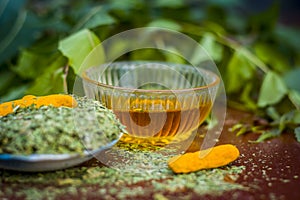 Powder of Indian iliac or neem with raw turmeric and honey used in many old and modern teeth treatments.