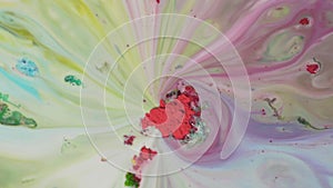 Powder paint with colored stains on water. Colored powder with chemical multicolored solutions move on surface of liquid