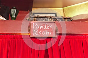 Powder Room Sign Over Curtains