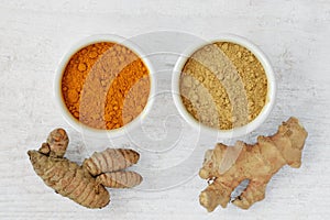 Powder and roots of turmeric and ginger