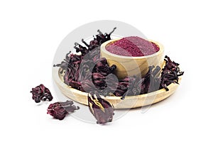 Powder of Roselle flower buds in wooden bowl on white background