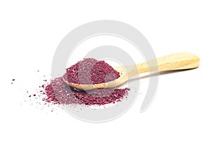 Powder of Roselle flower buds in wooden spoon on white background