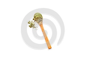 Powdered matcha green tea in wooden spoon