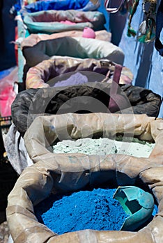 Powdered pigments in sacks