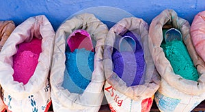 Powdered pigments in sacks