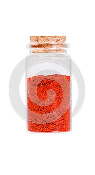 Powdered pimienta roja red pepper in a glass bottle with cork st