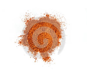 Powdered pimienta roja red pepper pile from top on white background photo