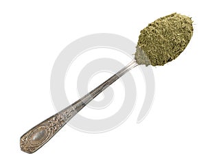 Powdered stevia herb in silver teaspoon cutout