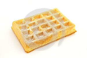 Powdered sugar on top of plain waffle isolated on white background