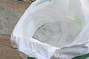 Powders of plaster gypsum in bag
