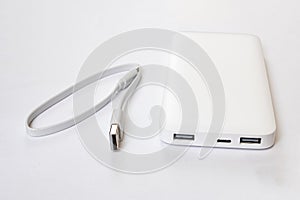 Power bank and cable on white background