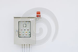 Power box for industry building electricity circuit breakers fuse switch panel with rotating alarm buzzer on white wall