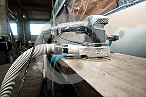 Power buffer machine used for polishing cars in auto service photo
